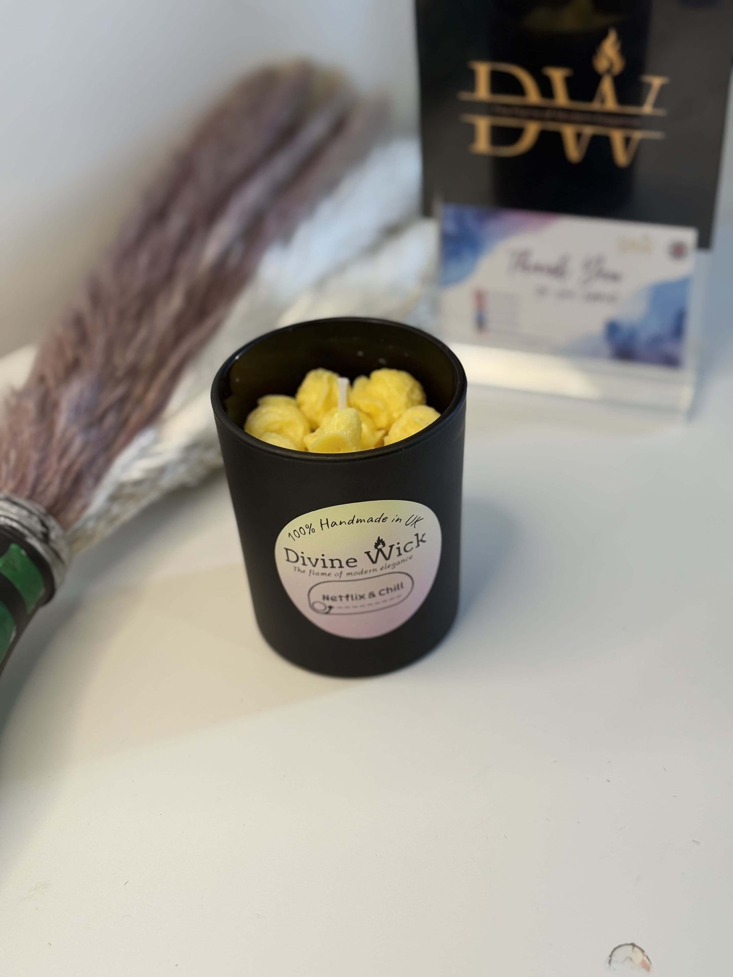 Popcorn theme candle by Divine Wick, perfect for cozy movie nights and enhancing your Netflix & chill experience.