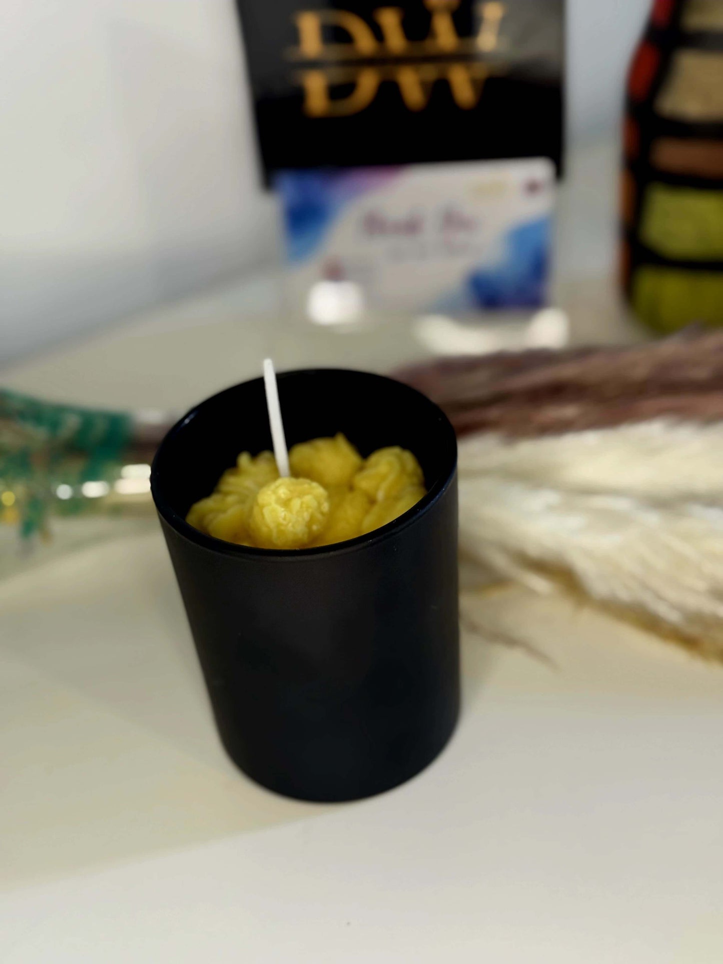 Popcorn theme candle in black container, perfect for movie date nights and creating a cozy Netflix ambiance.